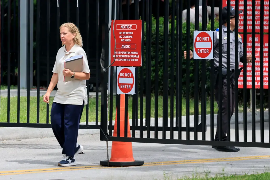 U.S. Rep. Debbie Wasserman Schultz exits the facility after conducting...