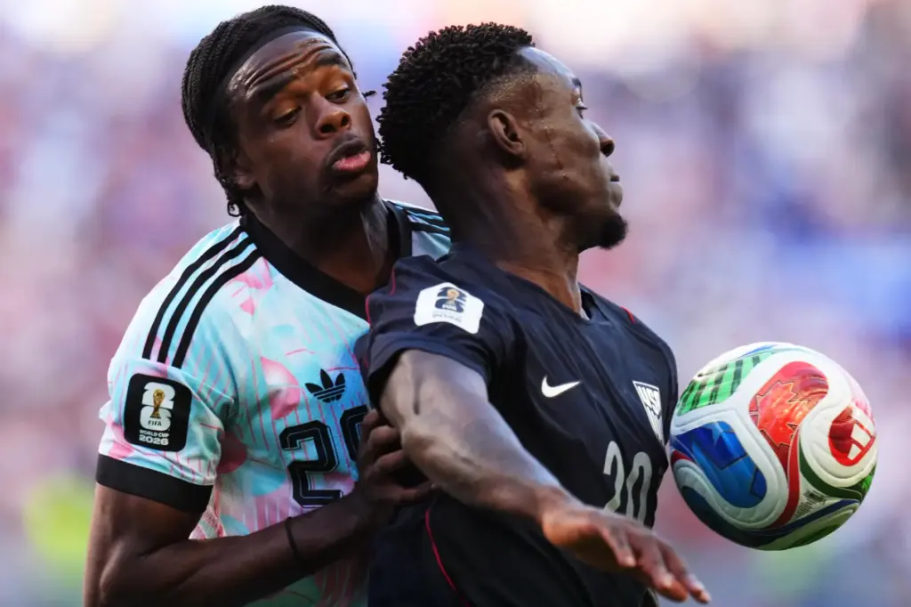 United States’ Folarin Balogun, right, and Belgium’s Nathan Ngoy battle...