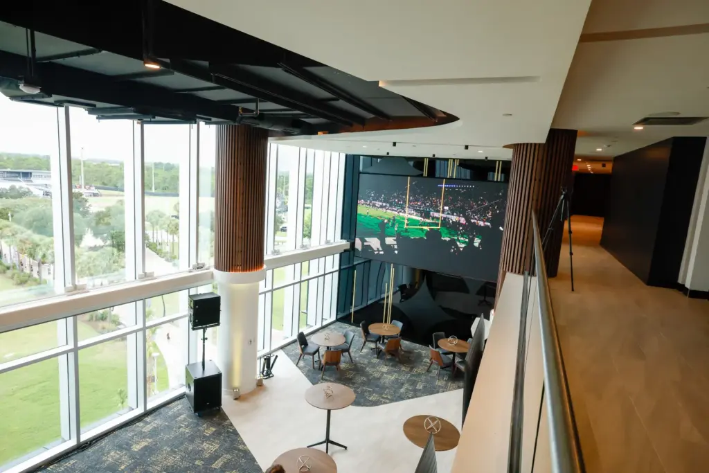 A large screen will play game-day action at the indoor...