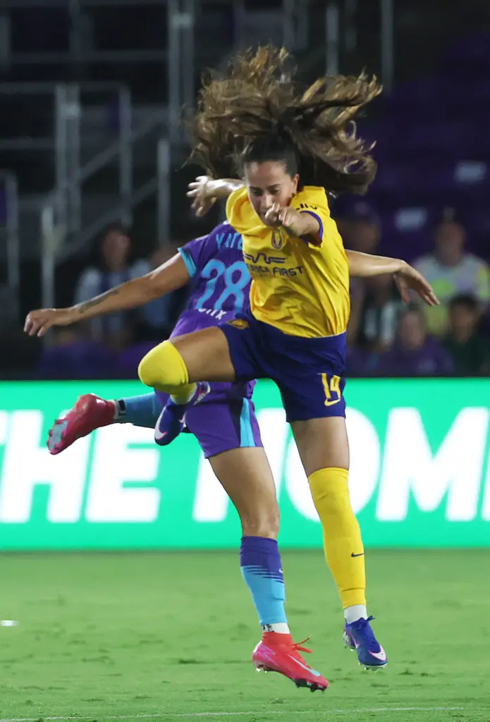 Utah player Nuria Rabano (14) and Orlando player Summer Yates...
