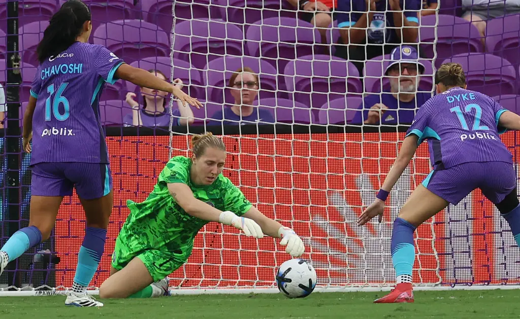 Orlando goalkeeper Anna Moorhouse (middle) reaches for the ball during...