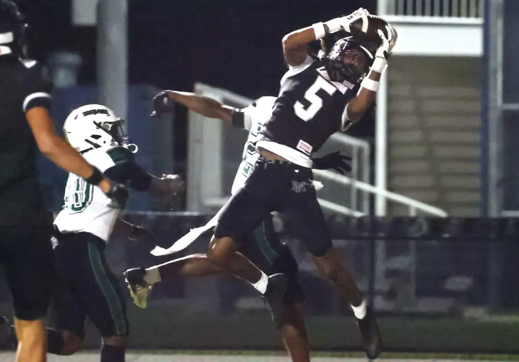 Lake Nona receiver Josiah Hall (5) makes an athletic catch...
