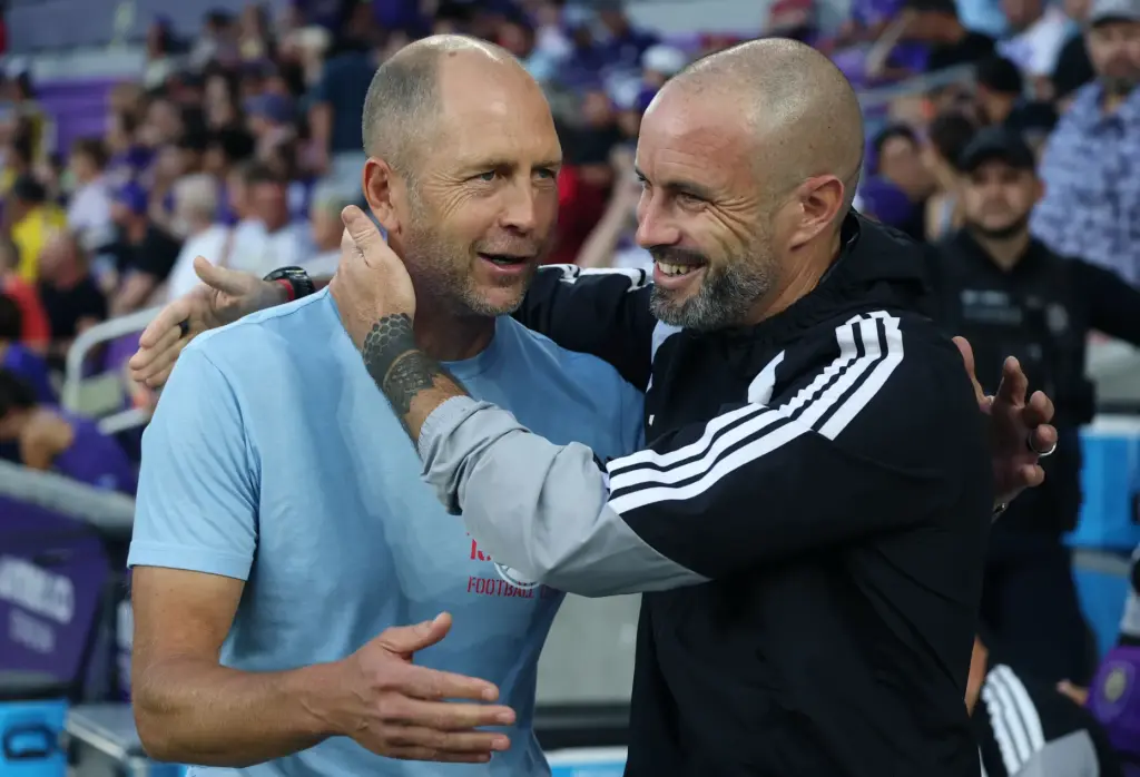 Chicago coach Gregg Berhalter, left, and Orlando coach Martin Perelman...