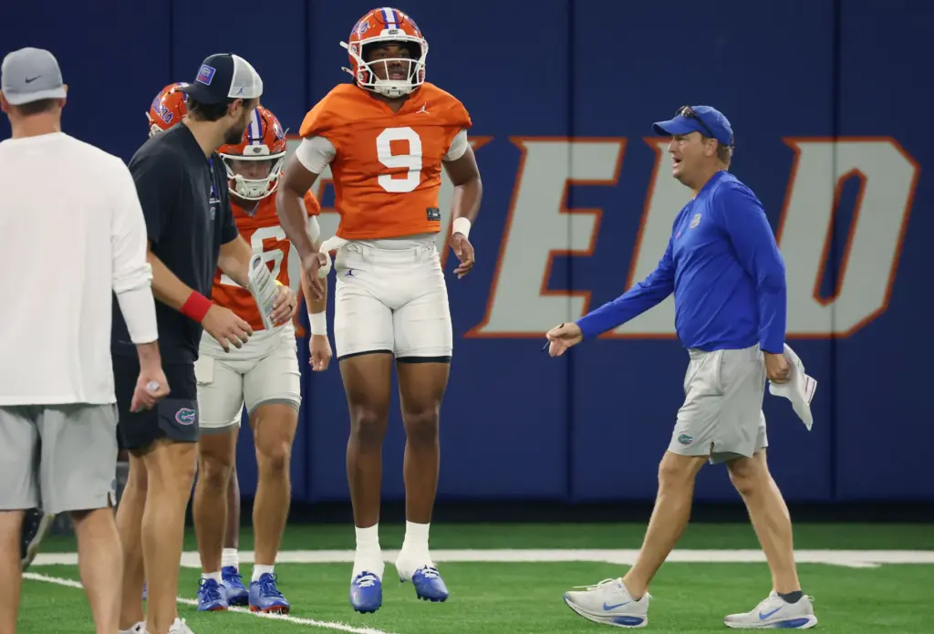 University of Florida offensive analyst Steve Spurrier Jr. (right) coaches...