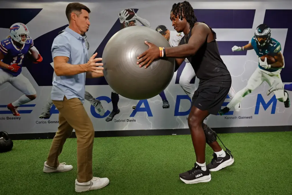 Former FSU linebacker Ethan Pritchard works out with physical therapist...