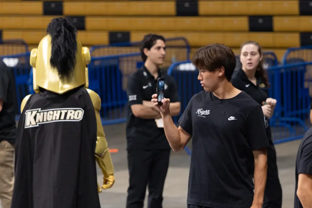 Knightâs Soccer Player Takahiro Fujita takes a photo during UCFâs...
