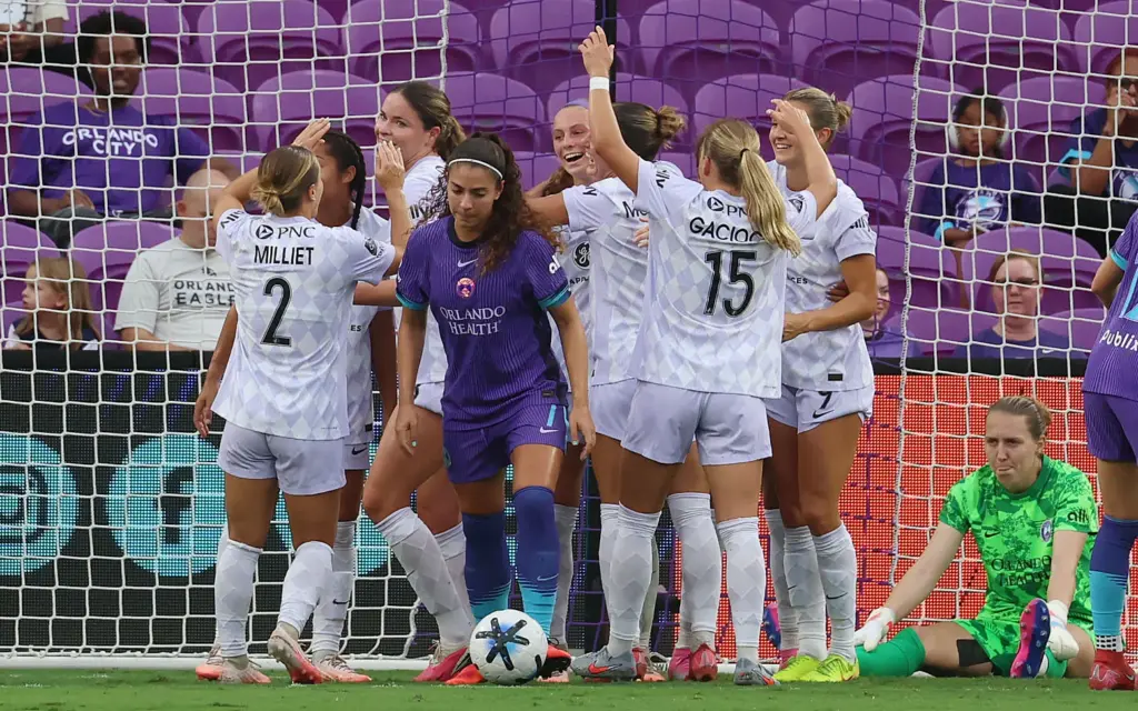 Louisville players celebrate after a goal during the Racing Louisville...