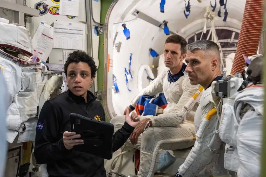 NASA astronaut Jessica Watkins (left) assists CSA (Canadian Space Agency)...