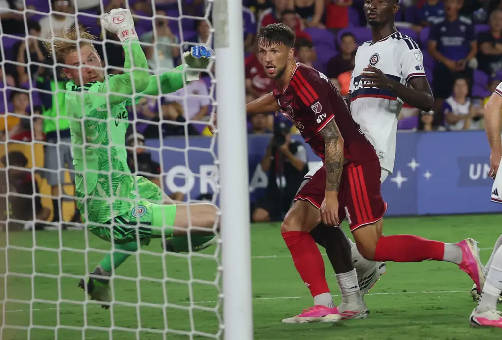 Orlando player David Brekalo (right) watches his goal score past...