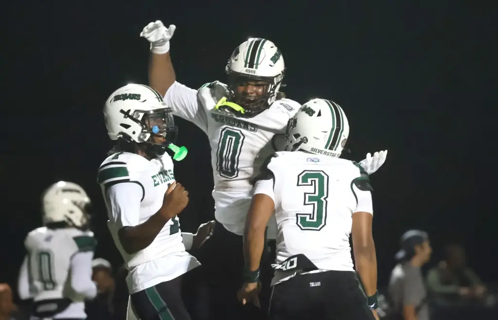Evans High players Alexander Rossi (0), William Jackson (1), and...