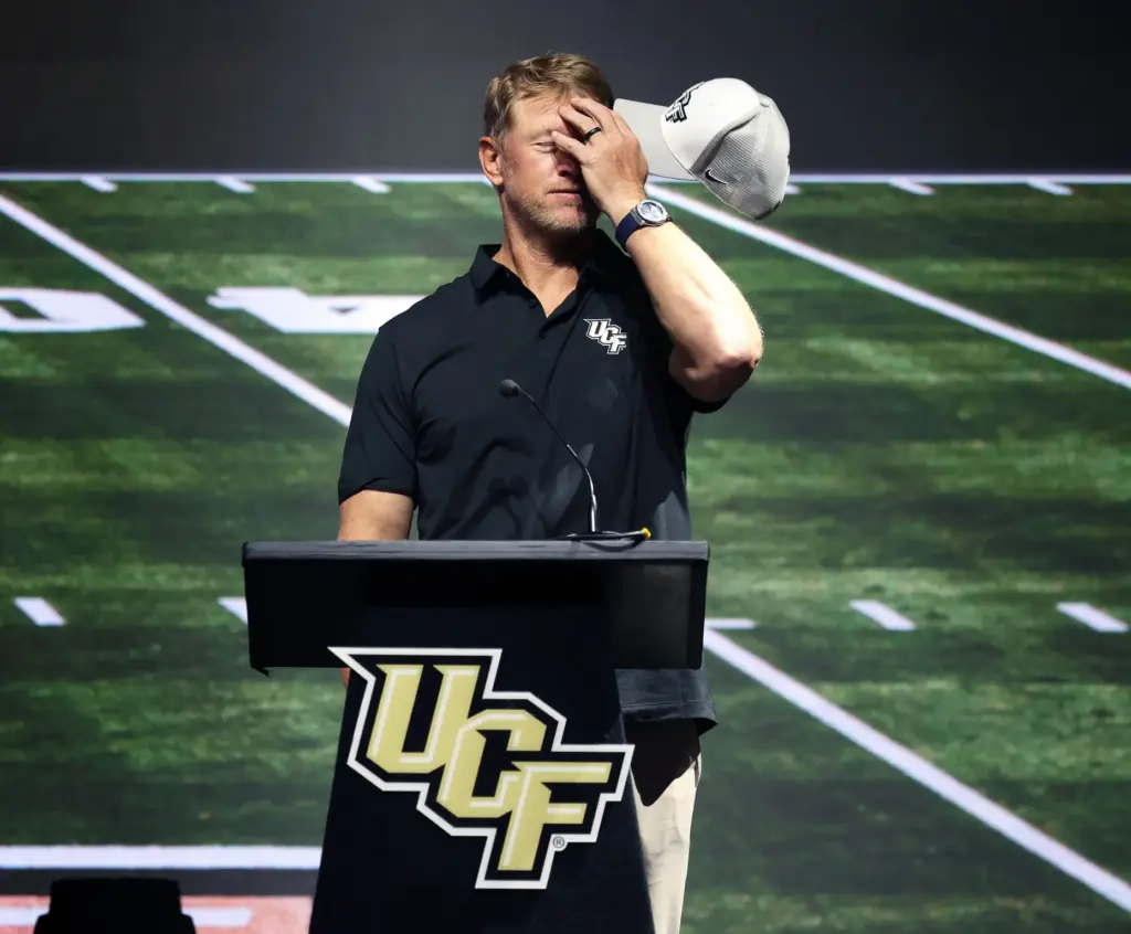 University of Central Florida football coach Scott Frost jokes about...