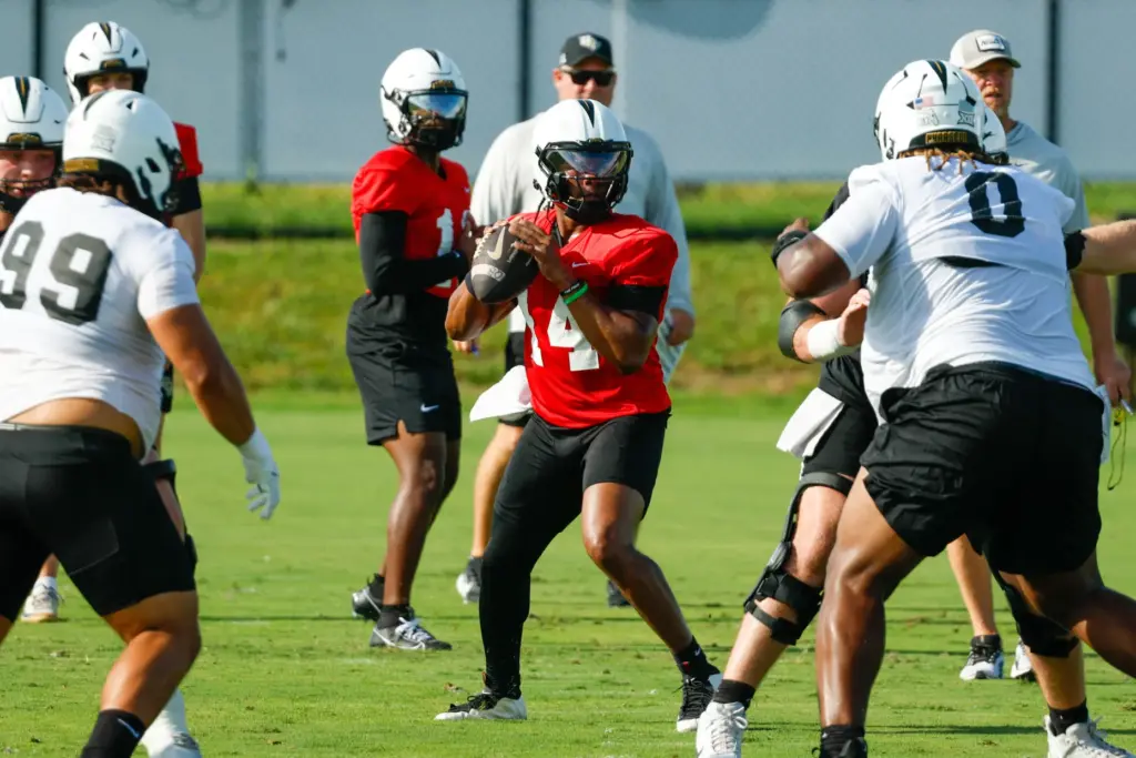 UCF Knights quarterback Alonza Barnett III (#14) runs through drills...