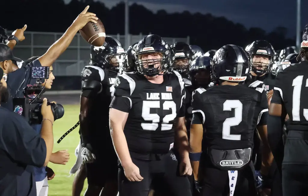 Lake Nona players cheer before the Evans High at Lake...