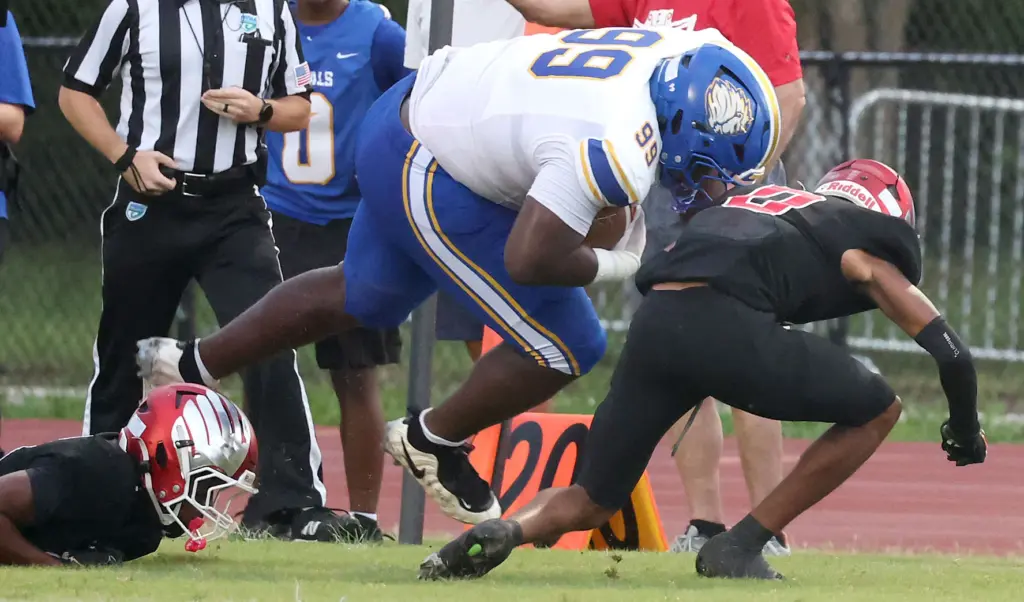 TFA tight end Jdeion Jackson (99), a 333-pound player, runs...