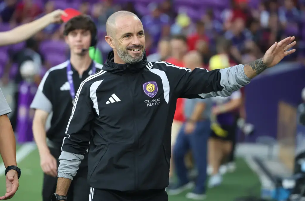 Orlando coach Martin Perelman walks onto the pitch for the...