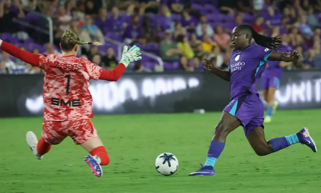 Orlando player Barbra Banda (11) scores a goal past Utah...