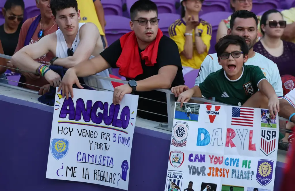 Fans hold signs during the FC Cincinnati at Orlando City...
