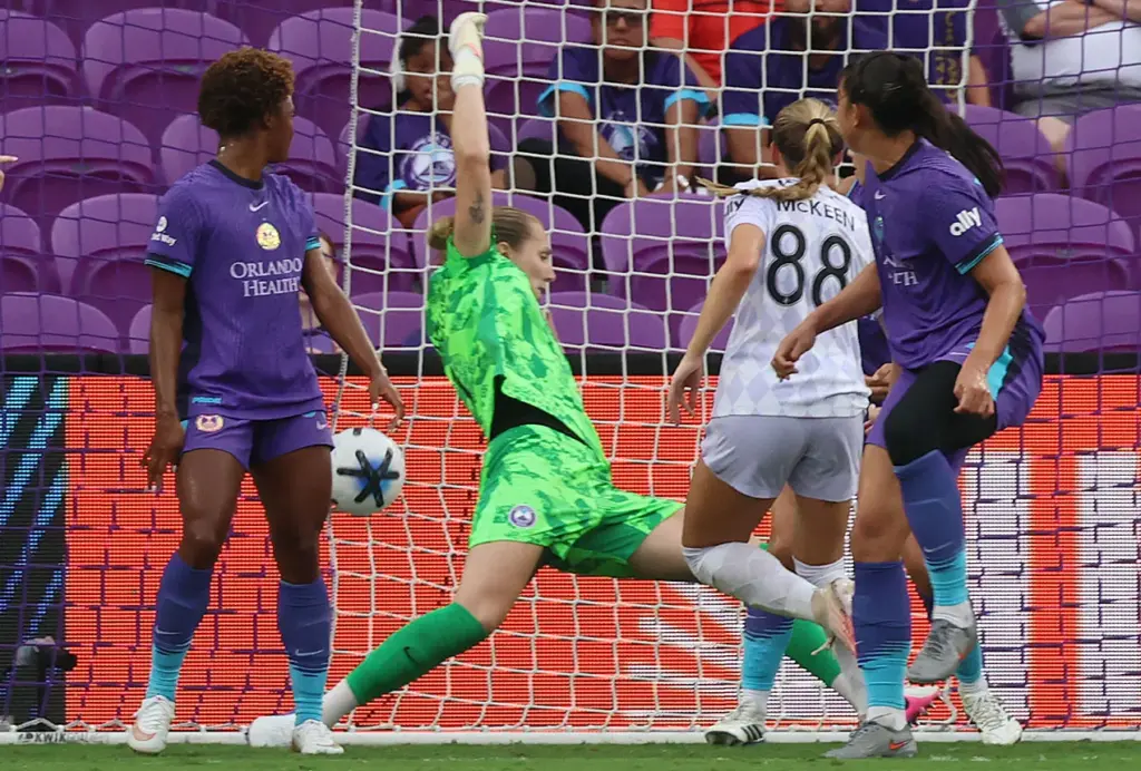 Louisville player Audrey McKeen (88) scores a goal past Orlando...