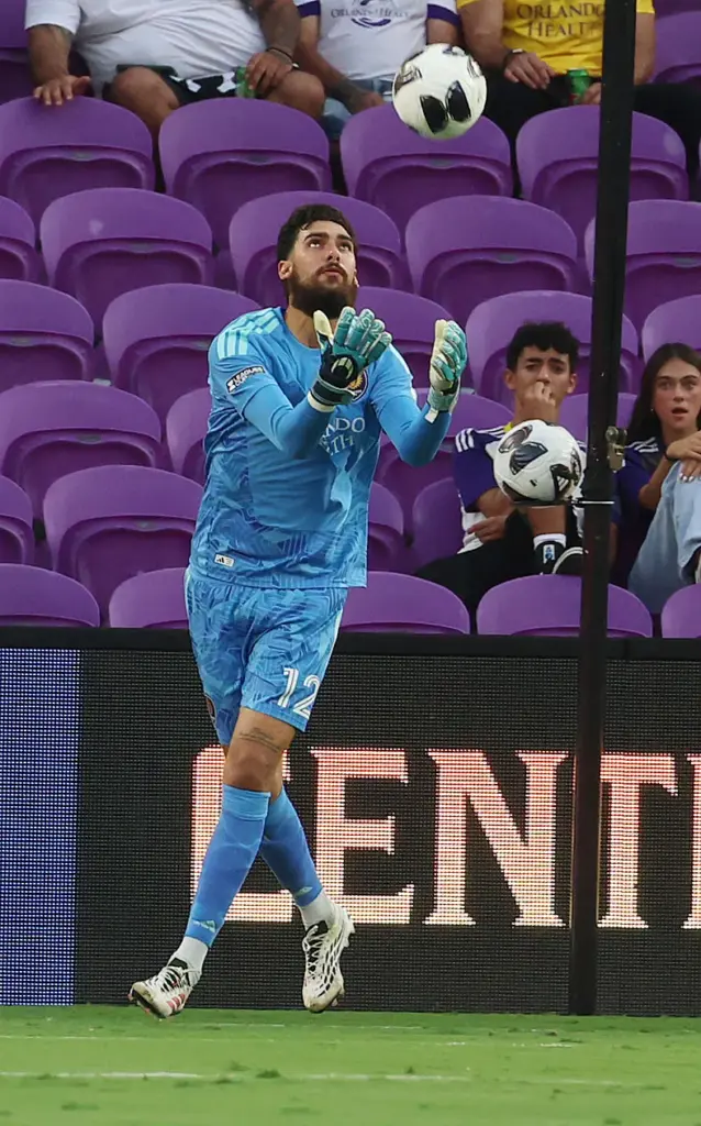 Orlando goalkeeper Javier Otero reaches for the ball during the...