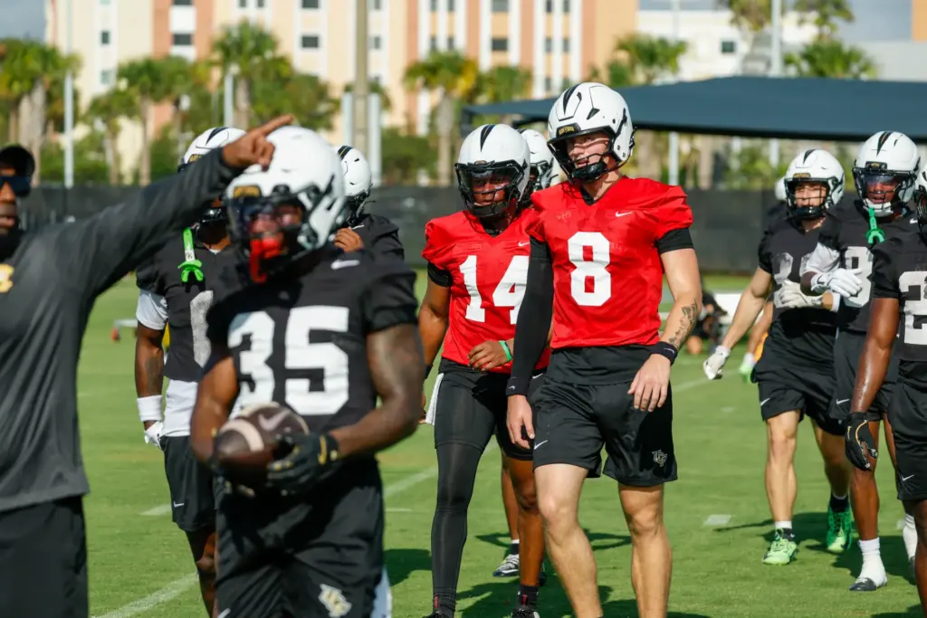 UCF Knights quarterbacks Alonza Barnett III (#14) and Kaleb Annett...