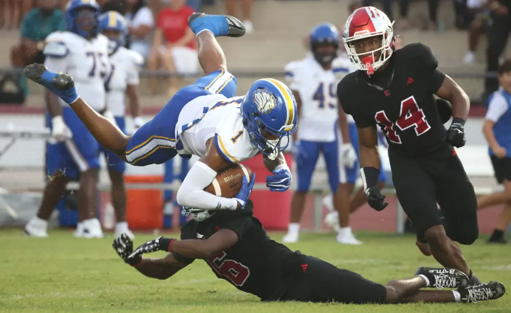 TFA wide receiver Jaiziah Battle (1) leaps over Edgewater safety...