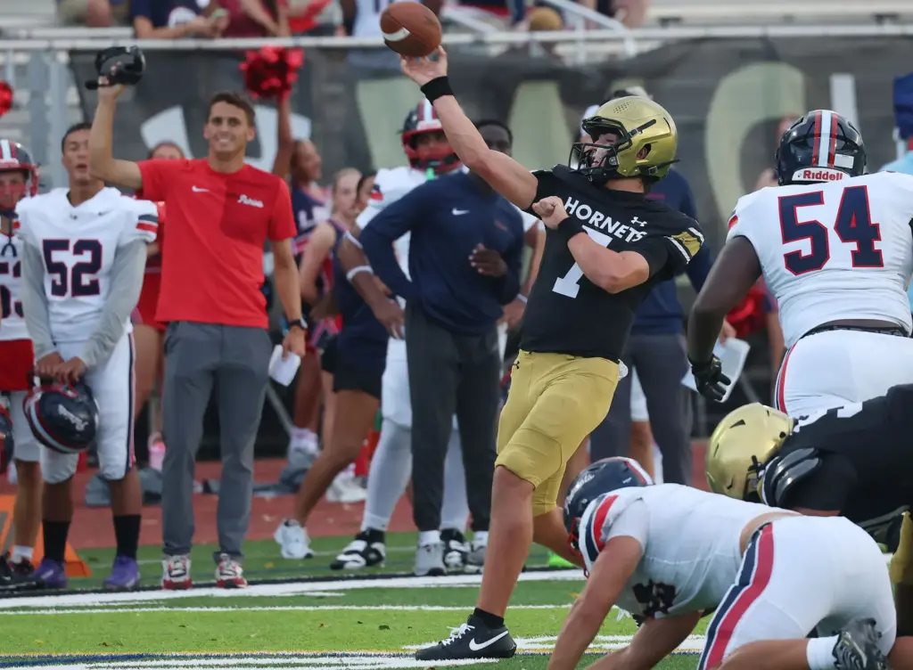 Bishop Moore quarterback Blake McCullough (7) throws during the Lake...