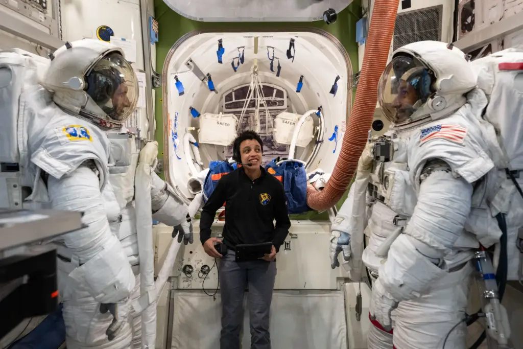 NASA astronaut Jessica Watkins (center) assists CSA (Canadian Space Agency)...