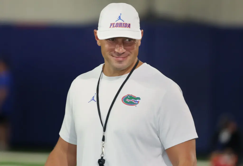 University of Florida head football coach Jon Sumrall smiles during...