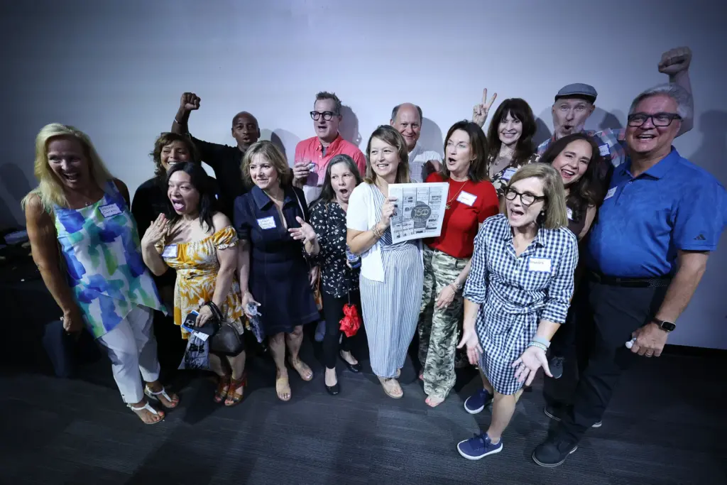 Former and current Orlando Sentinel journalists and employees are pictured...