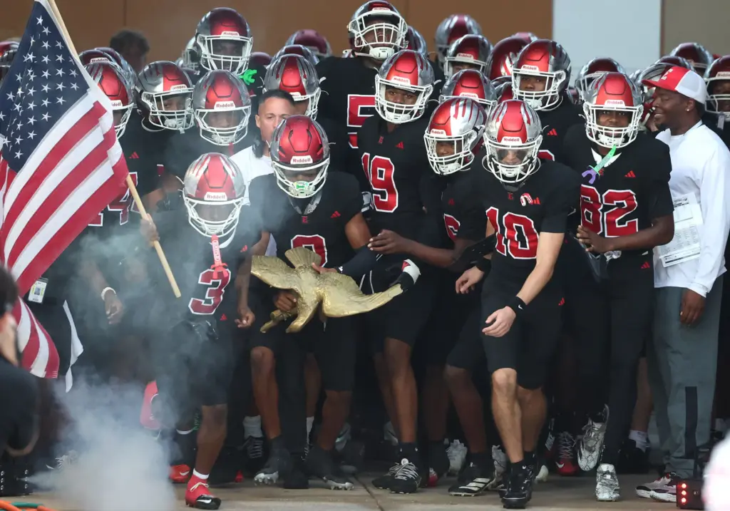 Edgewater players run onto the field for the The First...