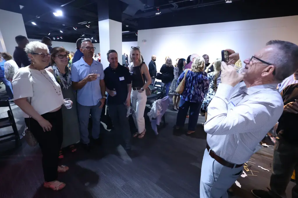 Former and current Orlando Sentinel journalists and employees are pictured...