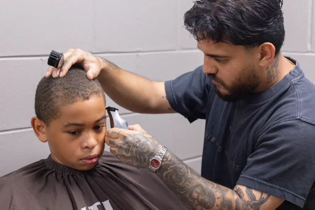 Josiah Collinsâs gets his haircut by Barber Rob Cisneros during...