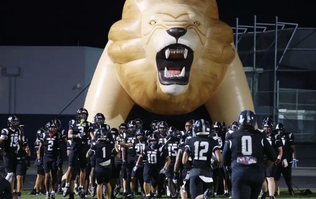 Lake Nona players are pictured before the Evans High at...