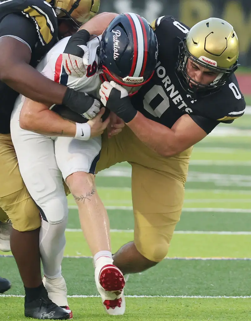 Bishop Moore linebacker Giacomo SanFilippo (0) brings down Lake Brantley...