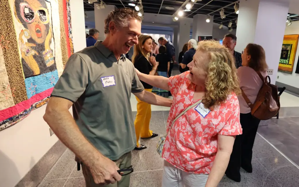 Former and current Orlando Sentinel journalists and employees are pictured...