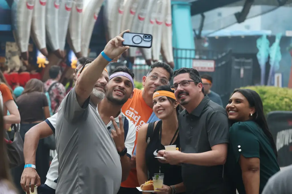 Attendees pose for photos during Scream & Sweat, an exclusive...