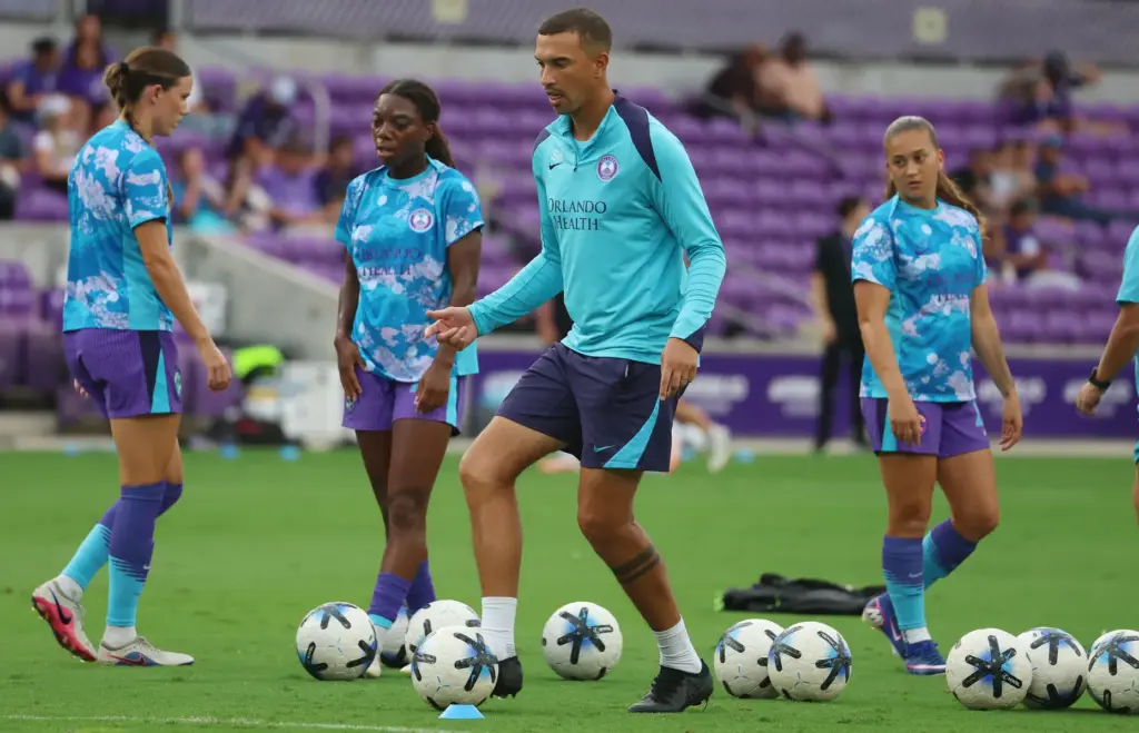 Orlando coach Seb Hines warms up players before the Racing...