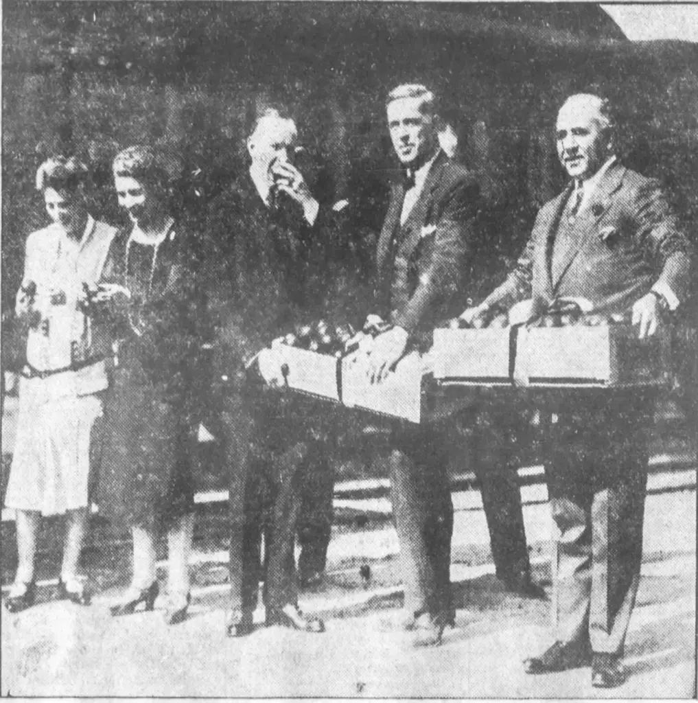 President Calvin Coolidge and his wife sample fruit presented to...