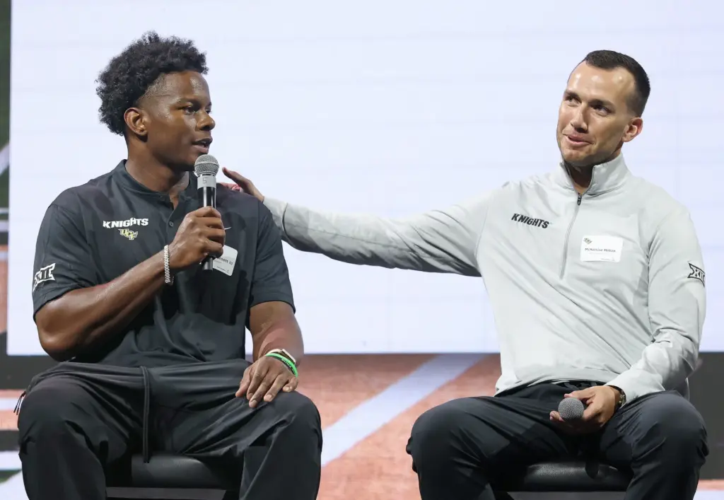 University of Central Florida quarterbacks coach McKenzie Milton, right, compliments...