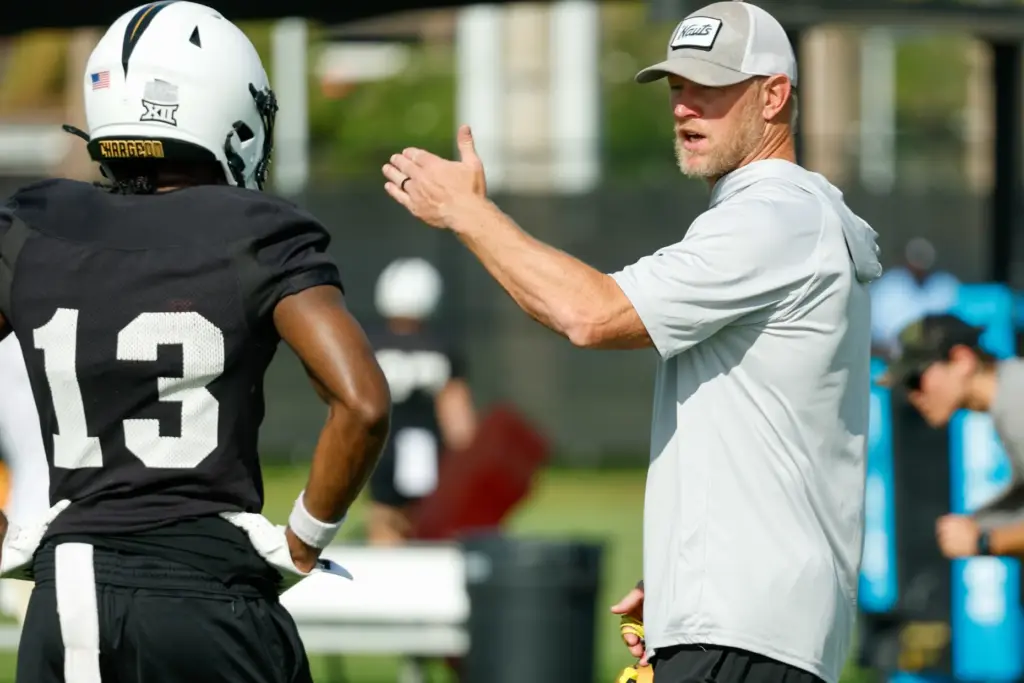UCF Knights Head Coach Scott Frost works with wide receiver...