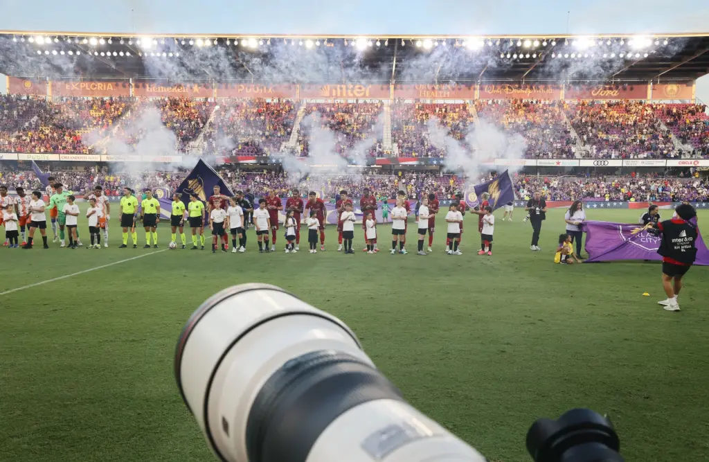 Both teams line up on the field before the FC...