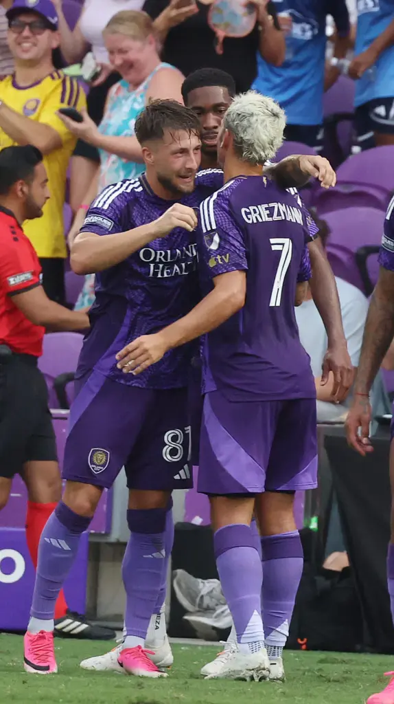 Orlando players Marco Pasalic (87) and Antoine Griezmann (7) celebrate...