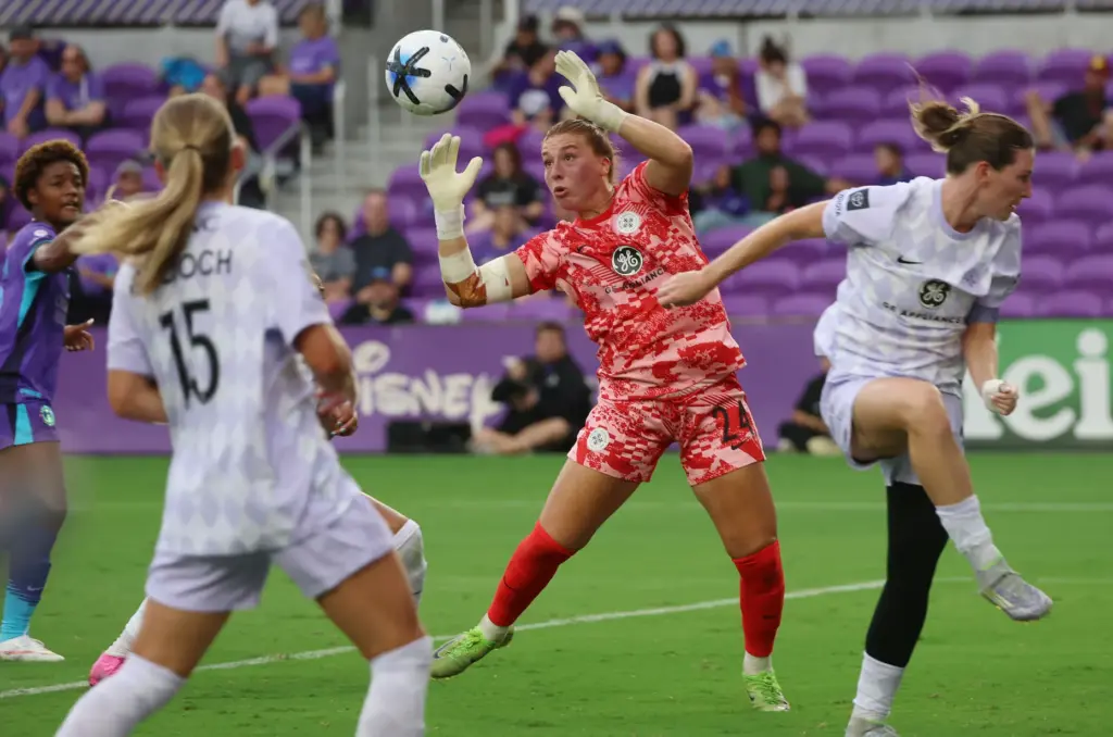 Louisville goalkeeper Jordyn Bloomer (24) reaches for the ball during...