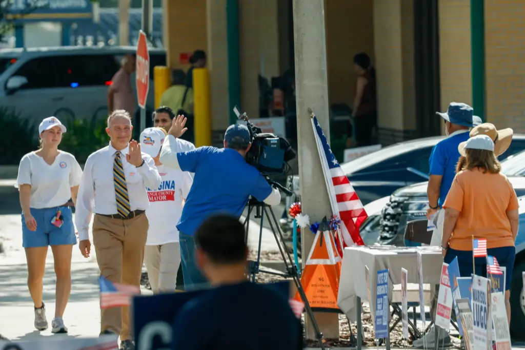 Orange County mayoral candidate Chris Messina exits the Alafaya Library...