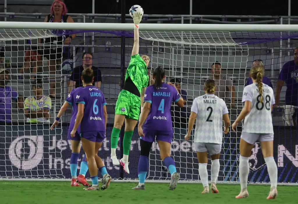 Orlando goalkeeper Anna Moorhouse leaps to stop a shot during...