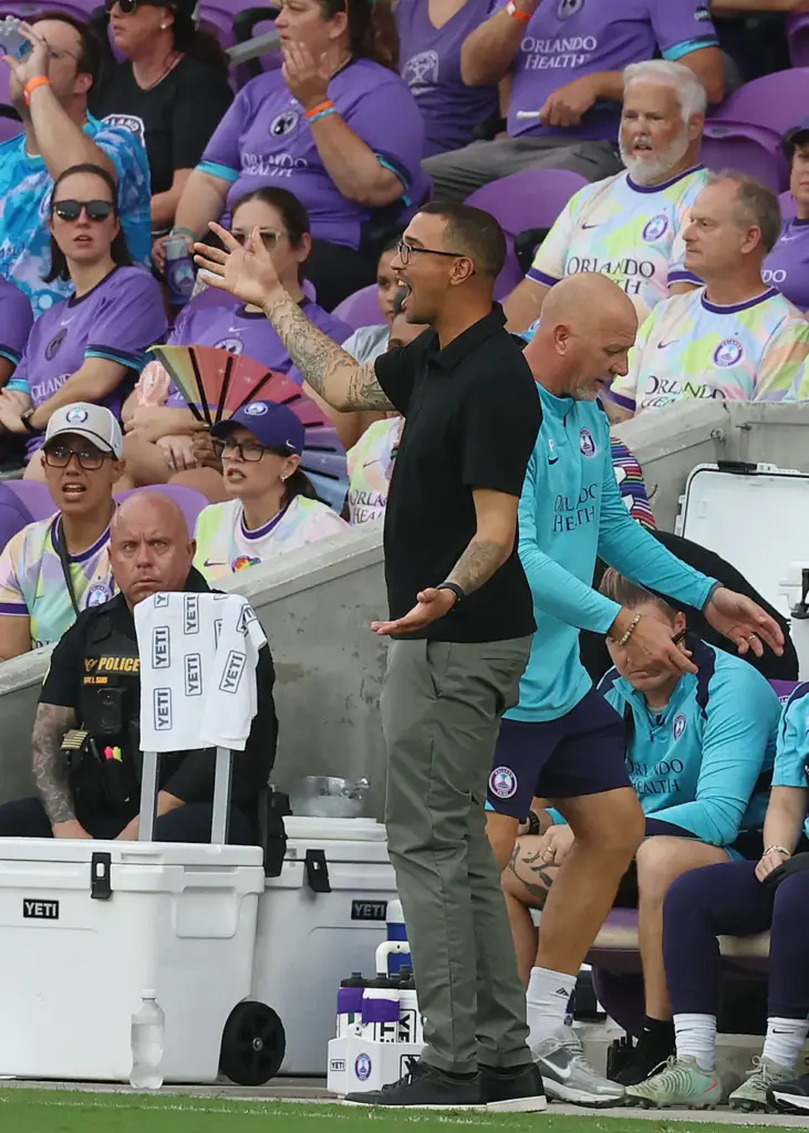 Orlando coach Seb Hines signals during the Racing Louisville FC...