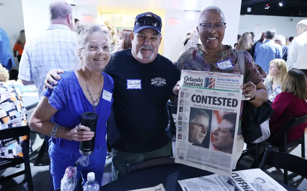 Former and current Orlando Sentinel journalists and employees are pictured...