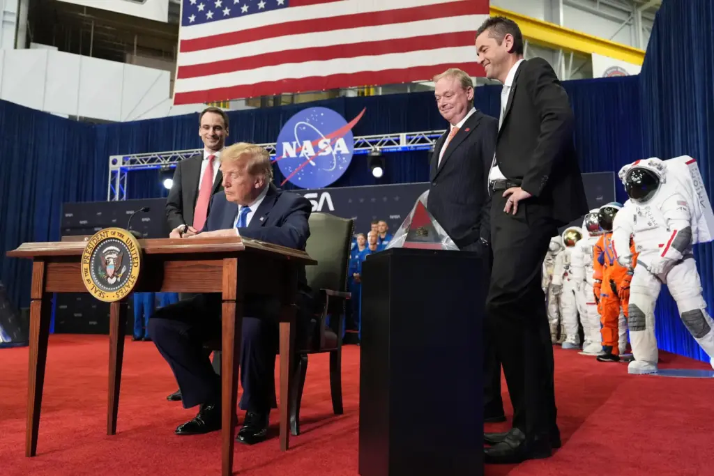 President Donald Trump signs an executive order creating the U.S....