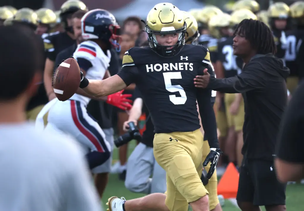 Bishop Moore wide receiver Magnus Talma celebrates after a catch...