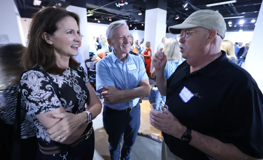 Former and current Orlando Sentinel journalists and employees are pictured...